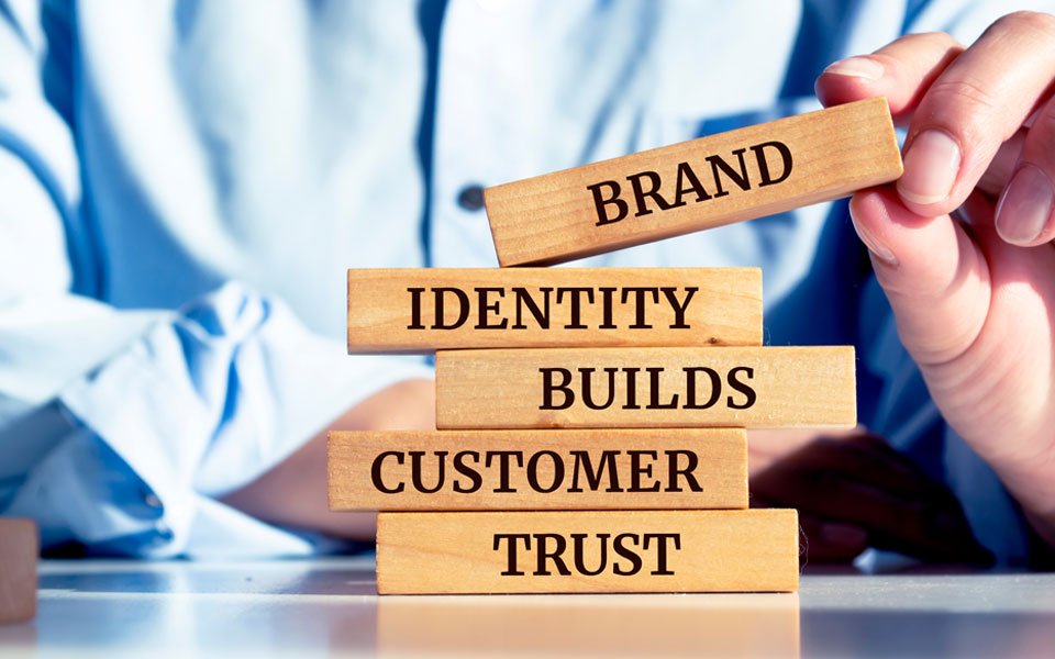 A modern living room with three cans of paint on the coffee table
